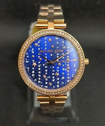 Reloj Michael Kors MK4451 para mujer con caja dorada rosada de 34 mm y esfera azul.