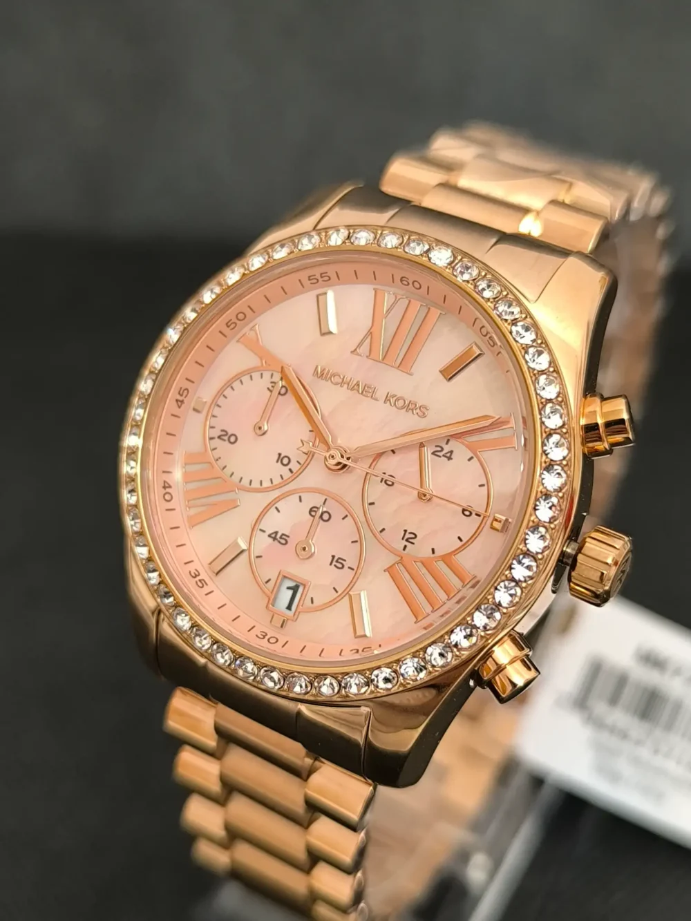 Reloj Michael Kors MK7242 Lexington con caja en oro rosa, cronógrafo y correa de acero inoxidable y resistencia al agua de 10 ATM.