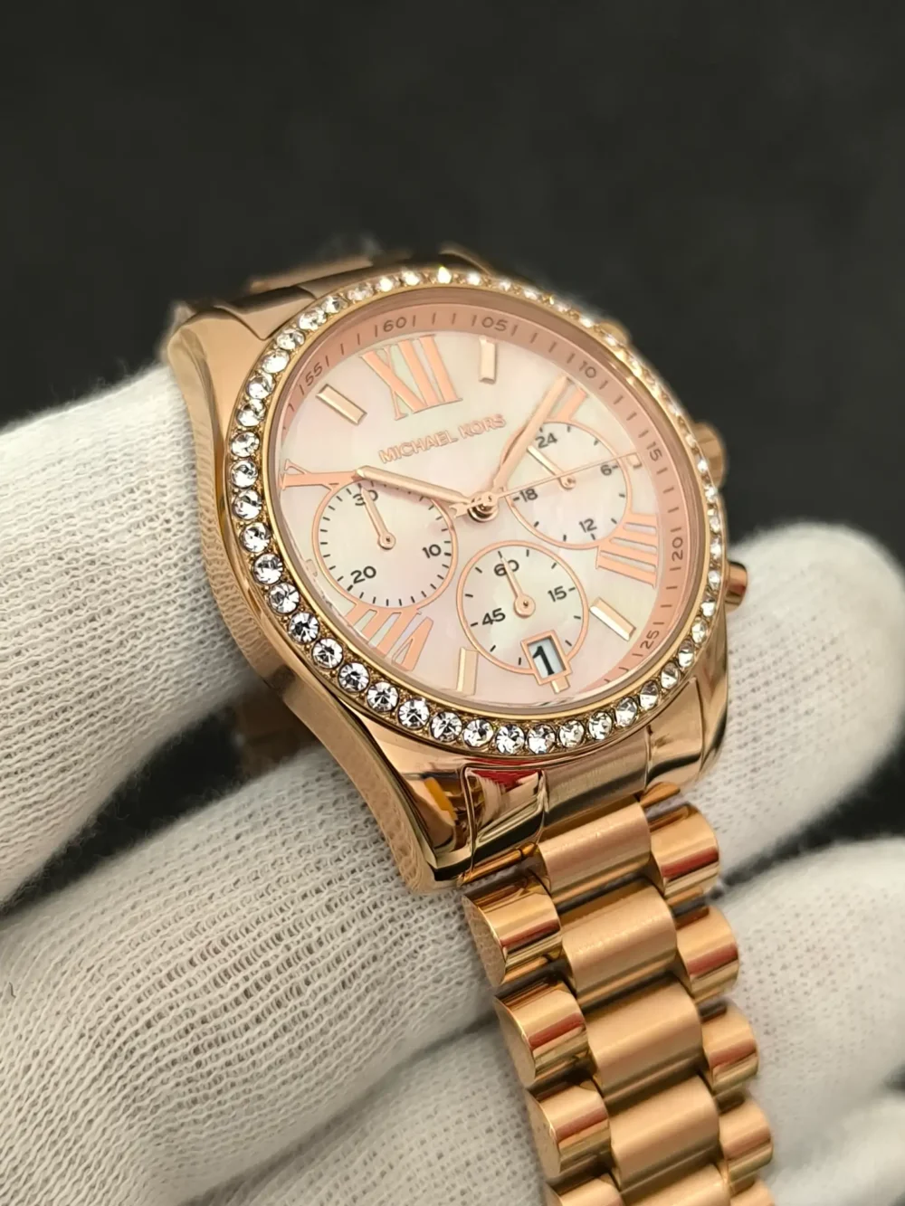 Reloj Michael Kors MK7242 Lexington con caja en oro rosa, cronógrafo y correa de acero inoxidable y resistencia al agua de 10 ATM.